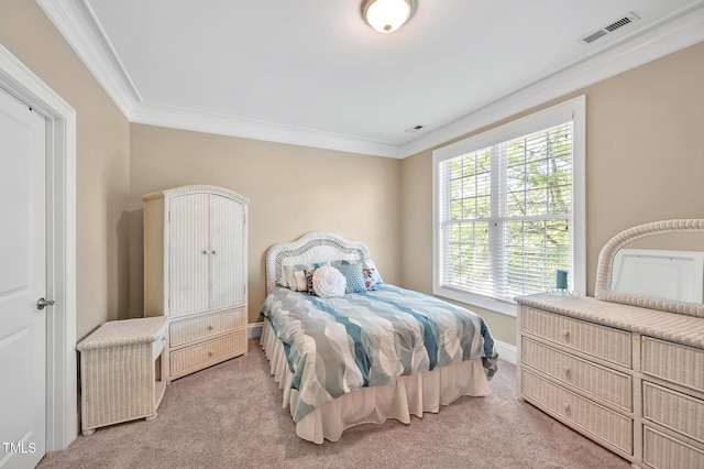 bedroom with baseboards, visible vents, ornamental molding, and carpet