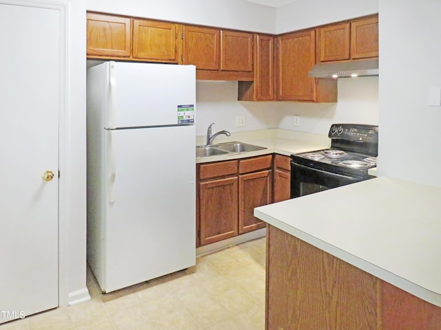 403 Gooseneck Dr Unit A-1, Cary, NC 27513 - kitchen featuring freestanding refrigerator, black electric range oven, under cabinet range hood, a sink, and light countertops