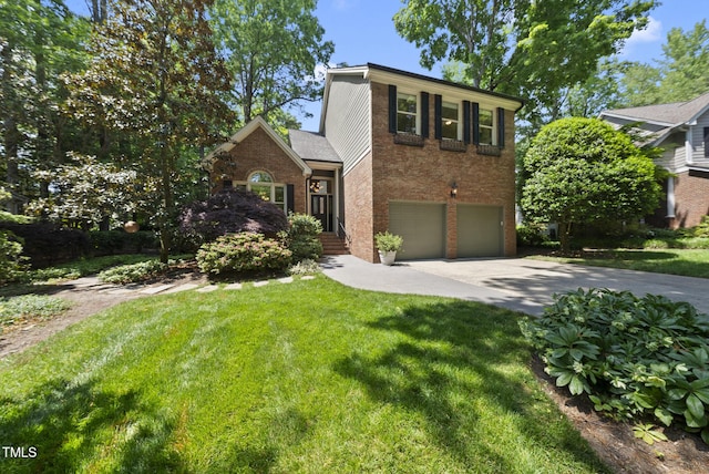 traditional home featuring brick siding, driveway, a front yard, and a garage
