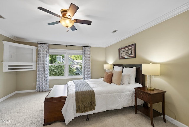 bedroom with baseboards, ornamental molding, and carpet flooring