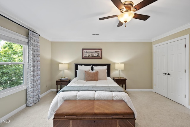 bedroom with crown molding, visible vents, baseboards, light colored carpet, and a ceiling fan