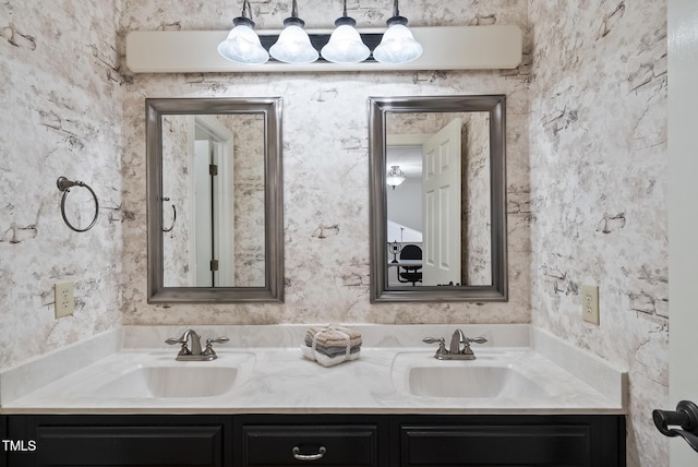 full bath featuring a sink and double vanity