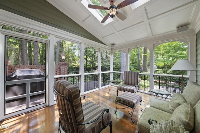 sunroom featuring a skylight and ceiling fan