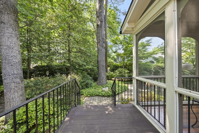 wooden terrace with a sunroom