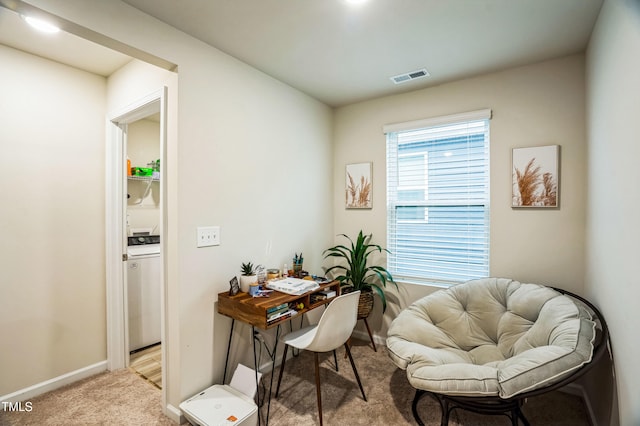 office with baseboards, visible vents, carpet, and washer / clothes dryer