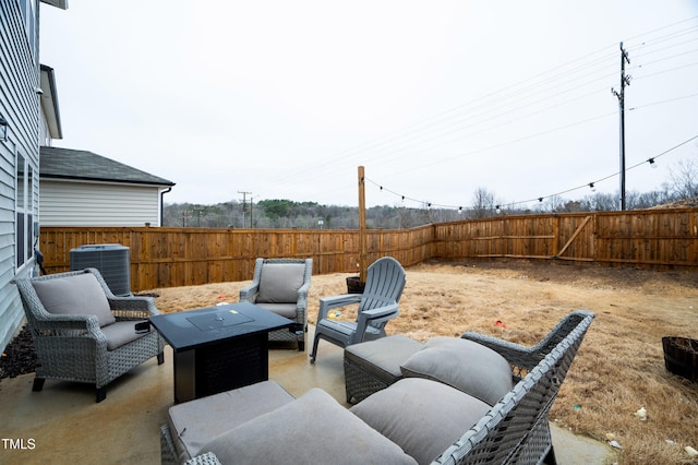view of patio with an outdoor hangout area, a fenced backyard, and central AC unit
