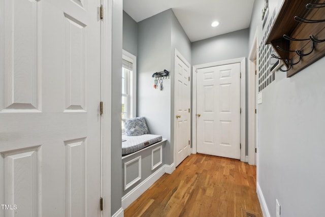 mudroom featuring recessed lighting, baseboards, visible vents, and light wood finished floors