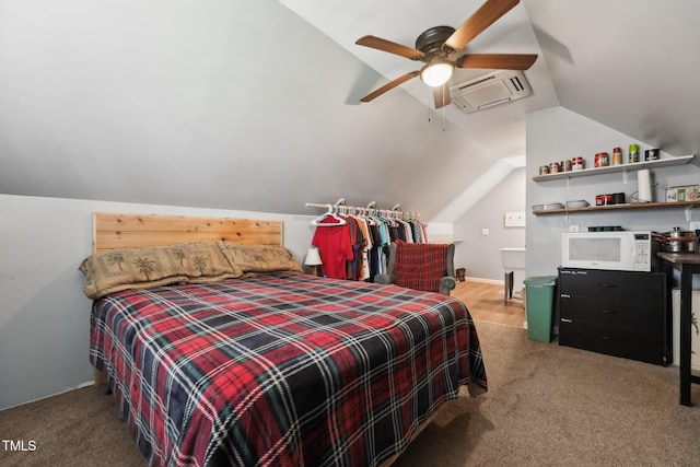 carpeted bedroom featuring a wall mounted air conditioner and lofted ceiling
