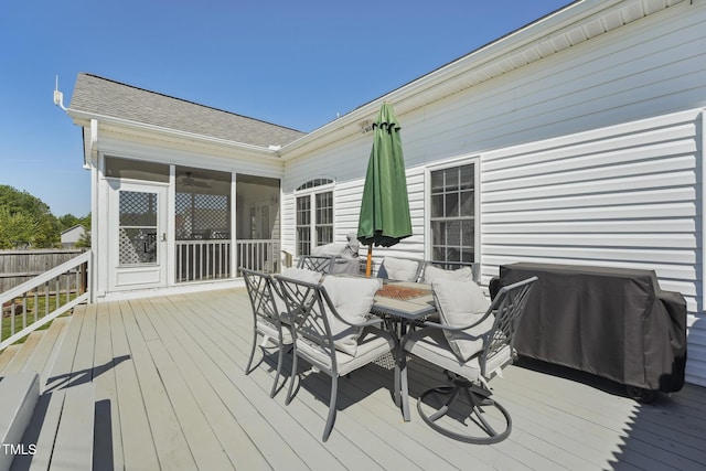 wooden terrace with fence and outdoor dining space