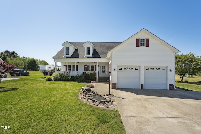 view of front facade with a shingled roof, a front lawn, covered porch, and concrete driveway