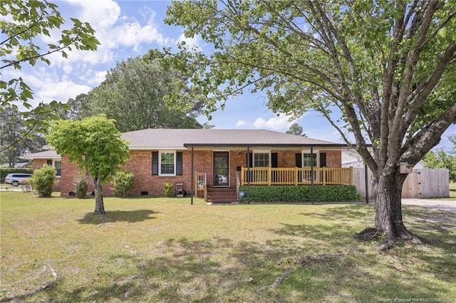 ranch-style home featuring a porch, crawl space, brick siding, and a front yard