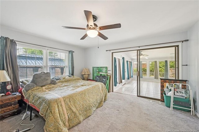 bedroom featuring carpet floors, a ceiling fan, and access to outside