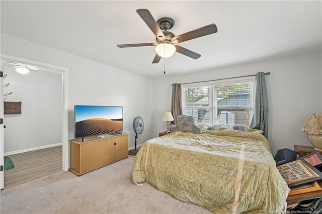 carpeted bedroom with a ceiling fan