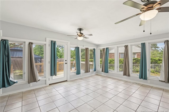 unfurnished sunroom featuring french doors, visible vents, tile patterned flooring, and vaulted ceiling