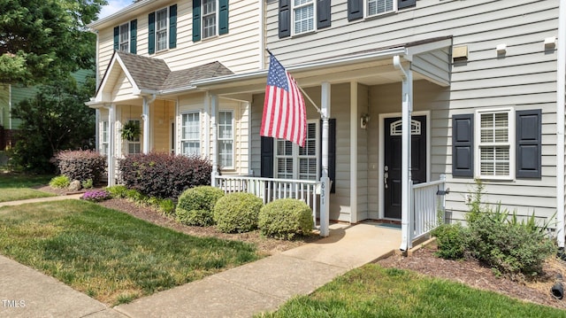property entrance featuring covered porch