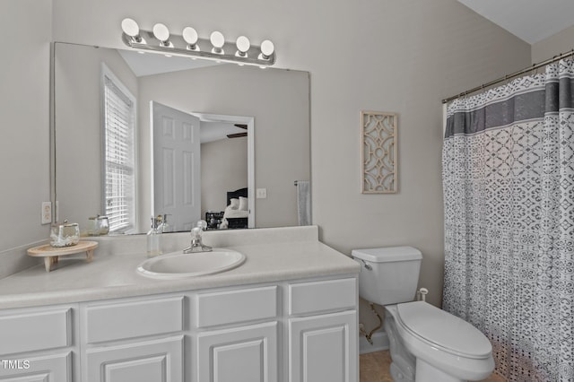 bathroom with vanity, ensuite bathroom, and toilet