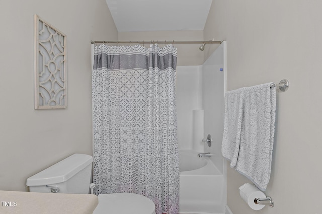 full bathroom featuring shower / bath combination with curtain and toilet
