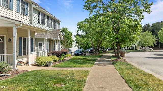 view of yard with covered porch