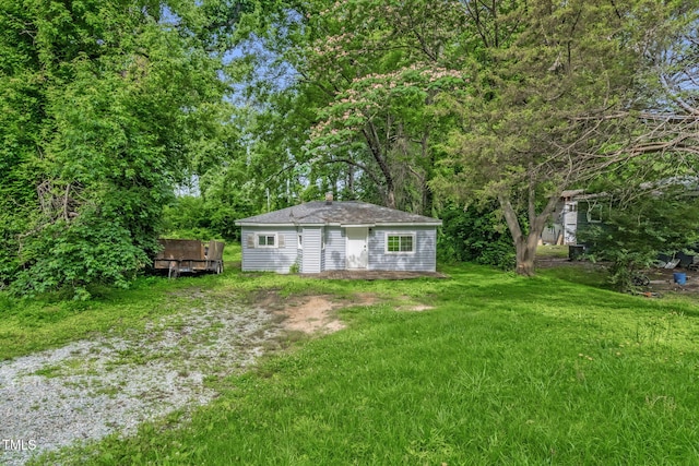 1219 Junction Rd, Durham, NC 27704 - view of green lawn featuring an outdoor structure