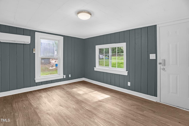 1219 Junction Rd, Durham, NC 27704 - unfurnished room with wood finished floors and an AC wall unit
