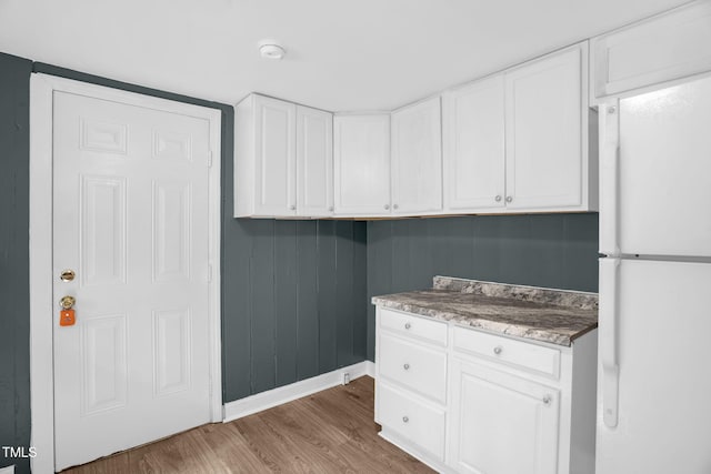 1219 Junction Rd, Durham, NC 27704 - laundry room featuring baseboards and wood finished floors
