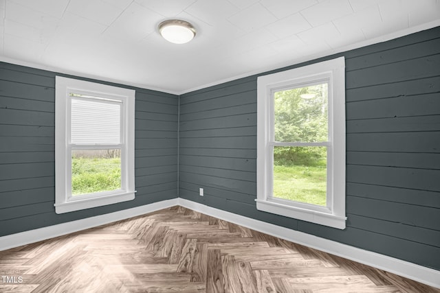 1219 Junction Rd, Durham, NC 27704 - spare room featuring plenty of natural light and wood walls