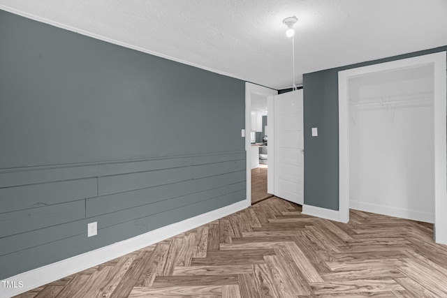 1219 Junction Rd, Durham, NC 27704 - unfurnished bedroom featuring a textured ceiling and a closet