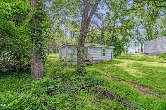 1219 Junction Rd, Durham, NC 27704 - view of grassy yard featuring entry steps