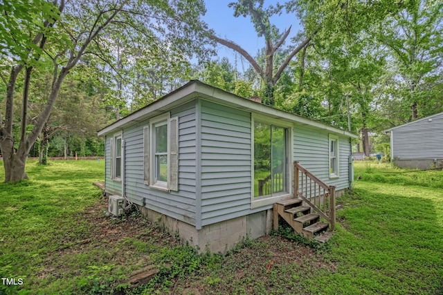 1219 Junction Rd, Durham, NC 27704 - view of side of property featuring entry steps and a lawn