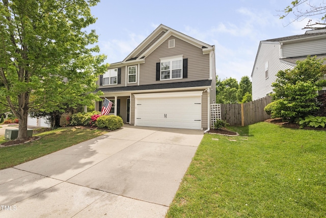 view of front of house with a garage, fence, a front yard, and concrete driveway