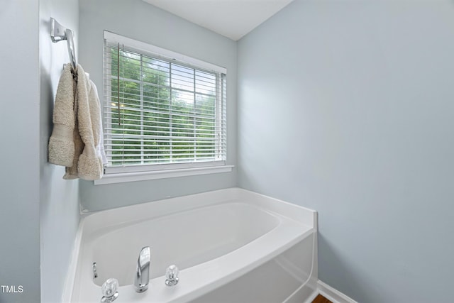 bathroom with a garden tub