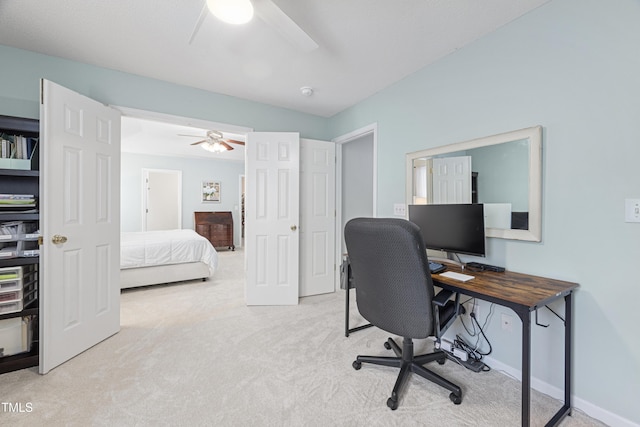 home office featuring baseboards, carpet flooring, and ceiling fan