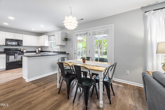 dining area featuring baseboards, recessed lighting, wood finished floors, and visible vents