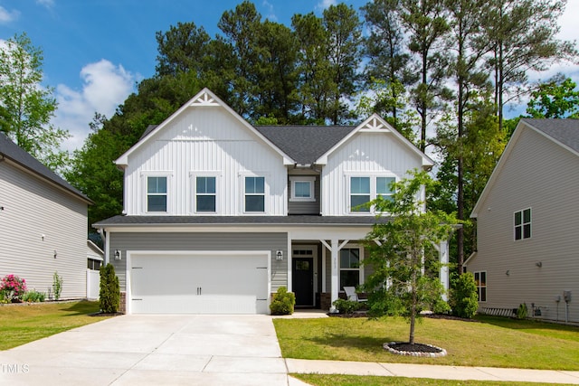303 Forestview Crest Way, Fuquay Varina, NC 27526 - view of front of house featuring concrete driveway, board and batten siding, an attached garage, and a front yard