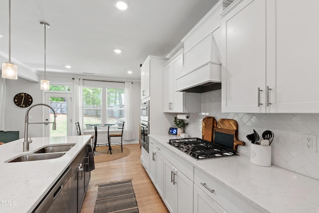 303 Forestview Crest Way, Fuquay Varina, NC 27526 - kitchen featuring light stone countertops, appliances with stainless steel finishes, a sink, white cabinetry, and recessed lighting
