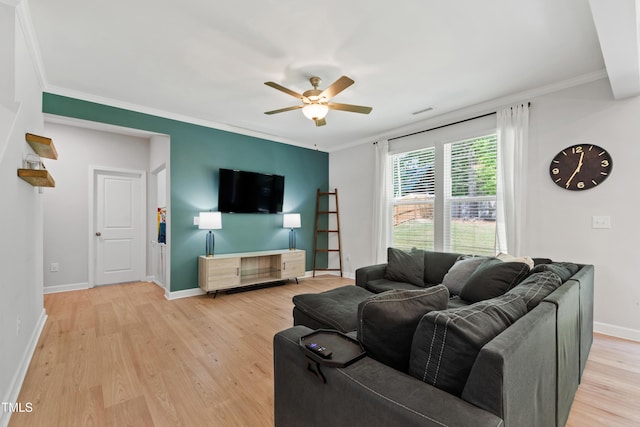 303 Forestview Crest Way, Fuquay Varina, NC 27526 - living area featuring a ceiling fan, baseboards, ornamental molding, and light wood-type flooring