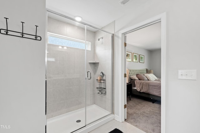 303 Forestview Crest Way, Fuquay Varina, NC 27526 - full bathroom featuring baseboards, tile patterned flooring, ensuite bathroom, and a stall shower