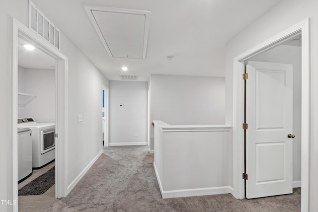 303 Forestview Crest Way, Fuquay Varina, NC 27526 - hall featuring separate washer and dryer, attic access, visible vents, and carpet flooring