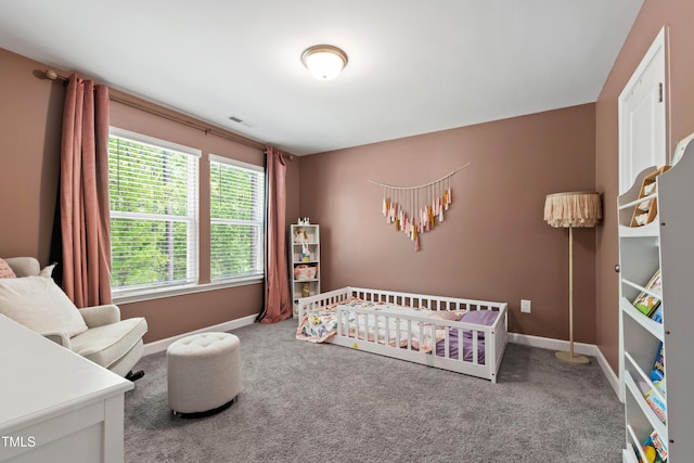 303 Forestview Crest Way, Fuquay Varina, NC 27526 - bedroom featuring baseboards, carpet flooring, and a nursery area