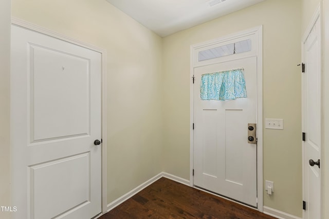 106 Churment Ct, Durham, NC 27703 - foyer featuring baseboards and dark wood-style flooring