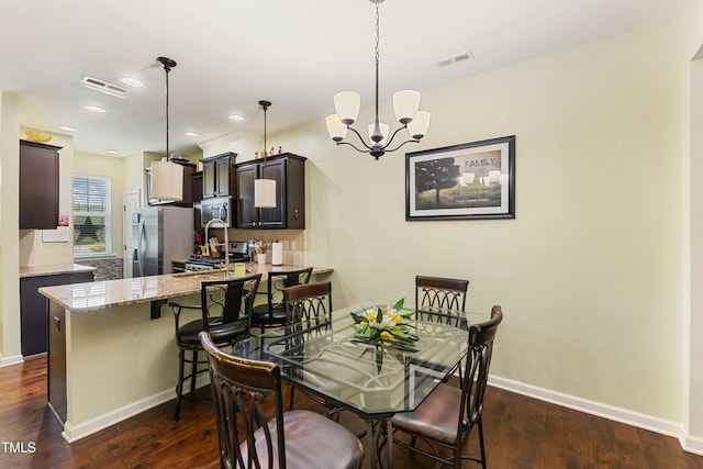 106 Churment Ct, Durham, NC 27703 - dining space featuring baseboards, a chandelier, dark wood-type flooring, and visible vents
