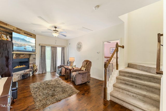 106 Churment Ct, Durham, NC 27703 - living area featuring stairway, wood finished floors, visible vents, a stone fireplace, and ceiling fan
