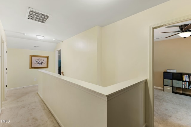 106 Churment Ct, Durham, NC 27703 - hallway featuring baseboards, visible vents, light colored carpet, and an upstairs landing