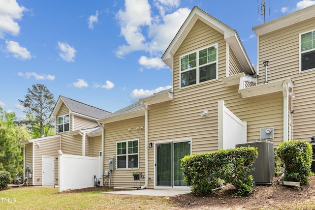 106 Churment Ct, Durham, NC 27703 - rear view of property with central AC unit and fence