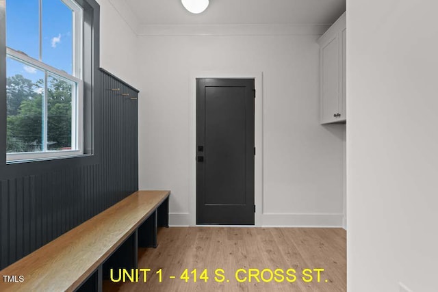 mudroom with baseboards and light wood-style floors