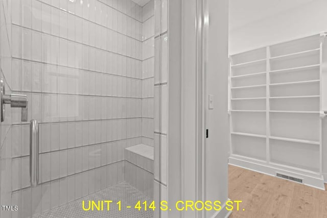 bathroom with wood finished floors and visible vents