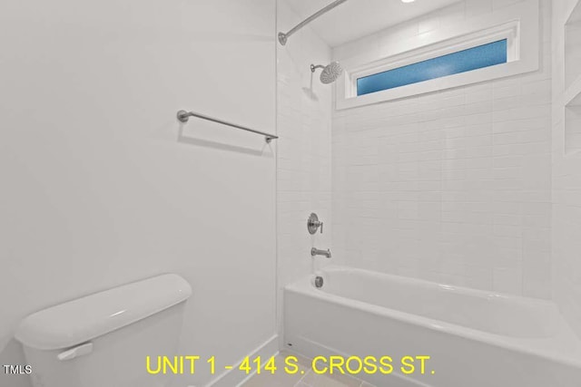 full bathroom with toilet and bathtub / shower combination