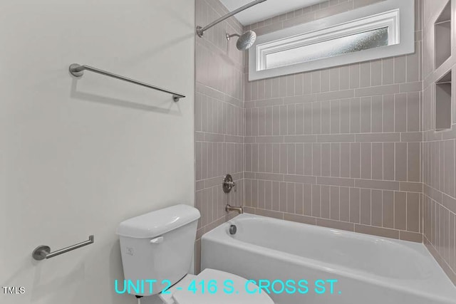 bathroom with shower / bathtub combination and toilet