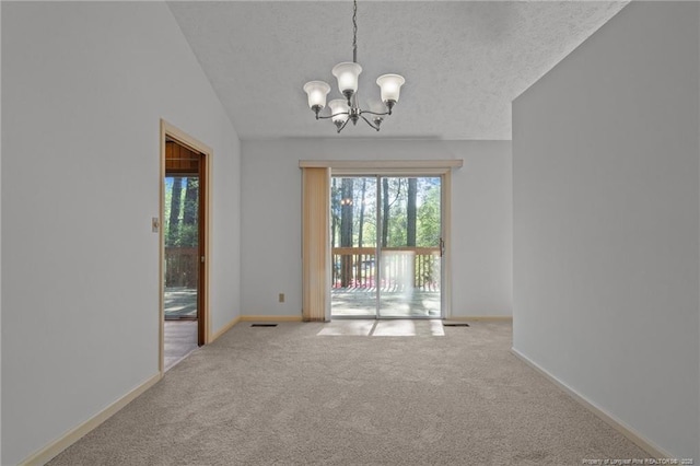 interior space featuring baseboards, carpet flooring, a chandelier, and a textured ceiling
