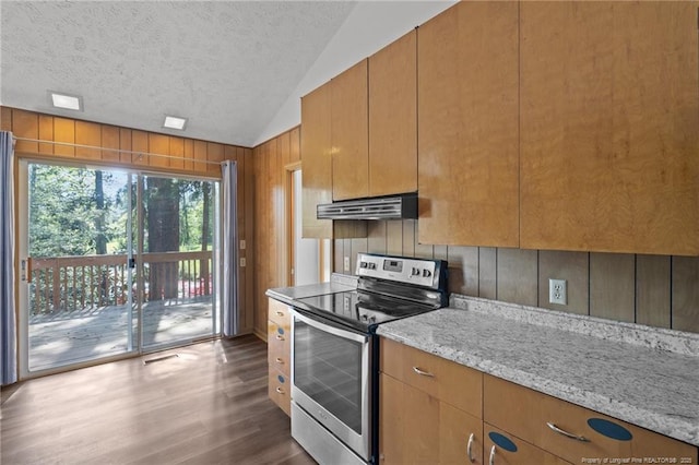 kitchen featuring under cabinet range hood, vaulted ceiling, a textured ceiling, stainless steel range with electric stovetop, and dark wood-style flooring